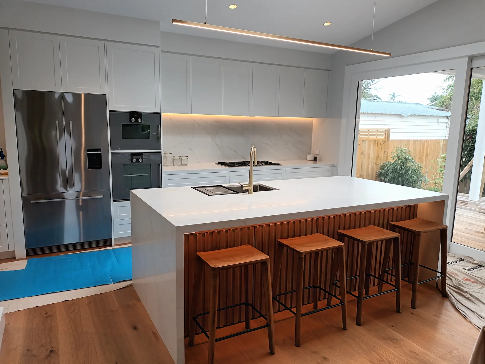 Detailed kitchen design with stone surfaces and integrated cabinetry